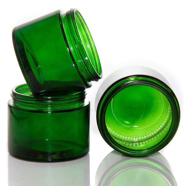 Leere grüne klare Glaskerzen mit Deckel