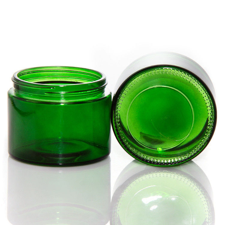 Leere grüne klare Glaskerzen mit Deckel