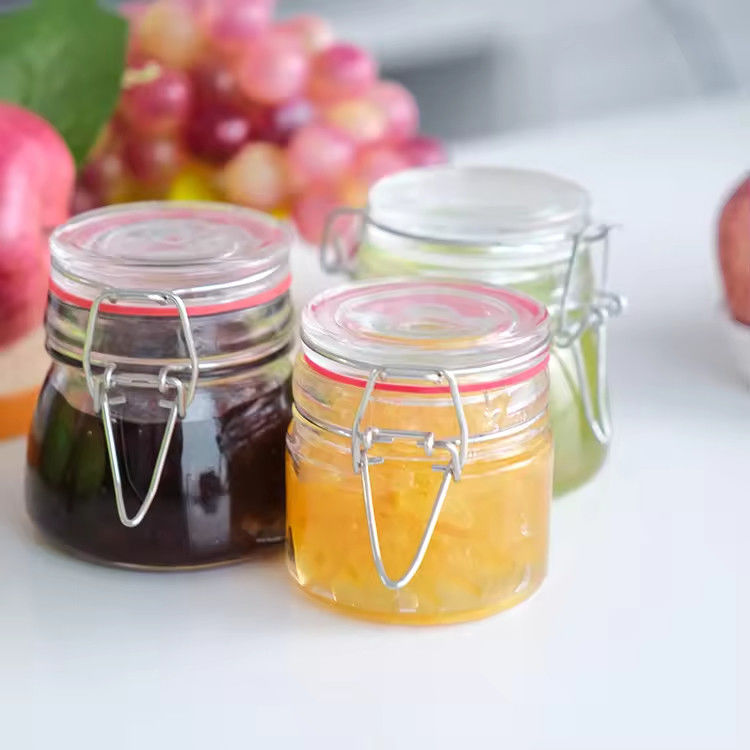 Popular Großhandel 100ml 180ml 280ml Lebensmittel-Grade runden Honig Glasglas mit Clip-Abdeckung