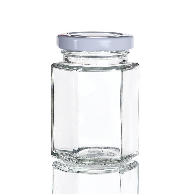 Durchsichtige Flaschenflaschen mit Deckel Hexagon Glaslagerflasche für Teekanister